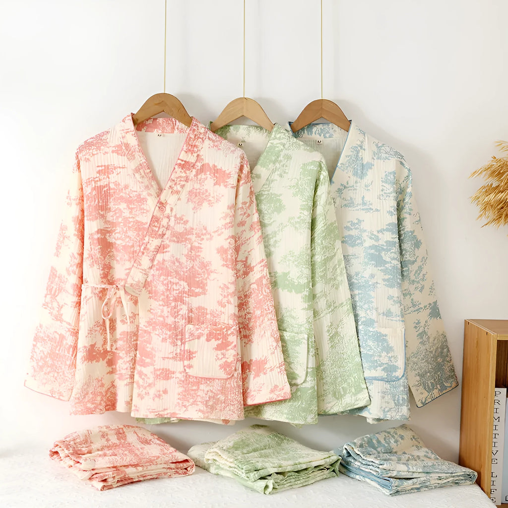 Women's pink pure cotton gauze long sleeve pyjama set with lace-up trousers laid flat.
