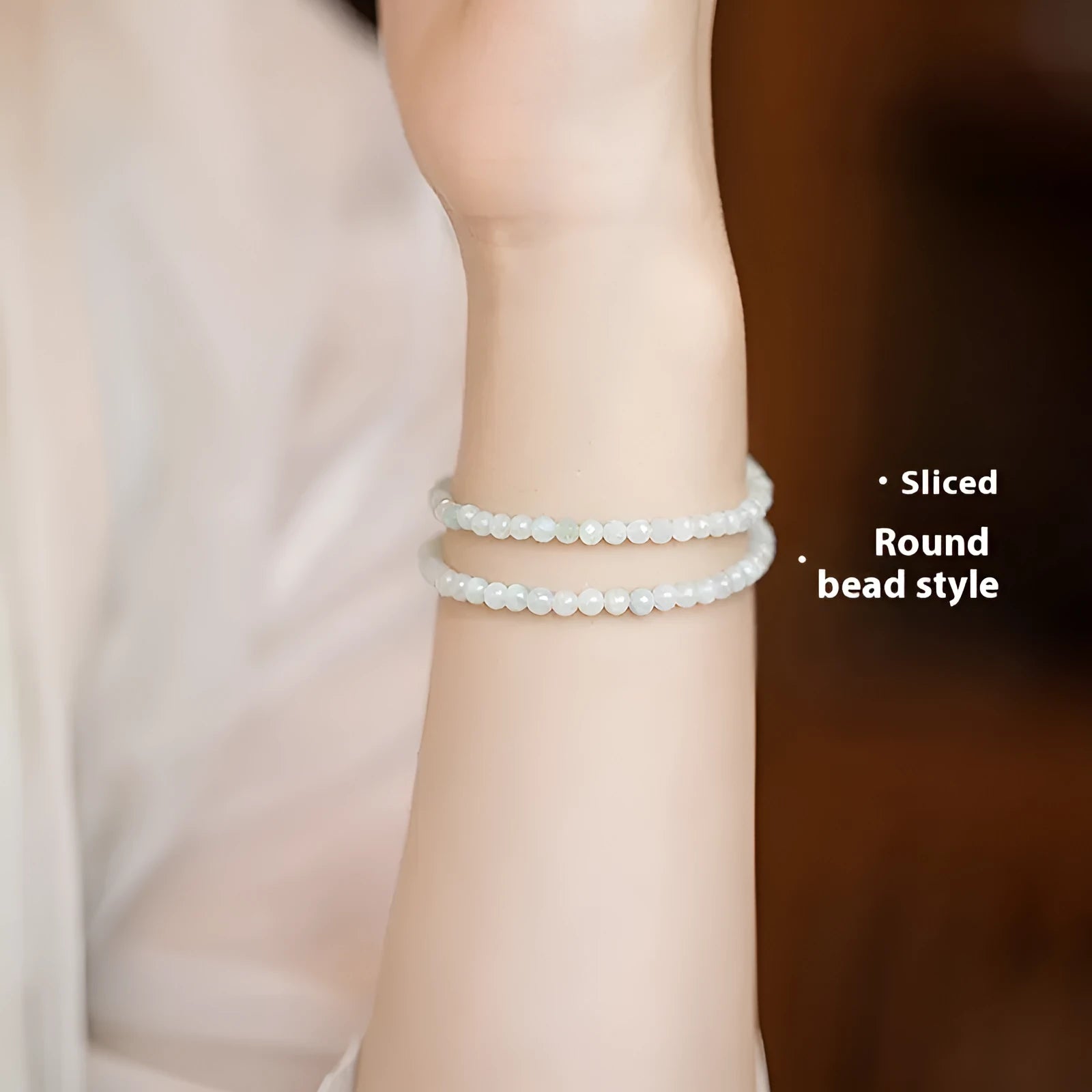 Women's Korean style retro jade bracelet in ball type design on a wrist.