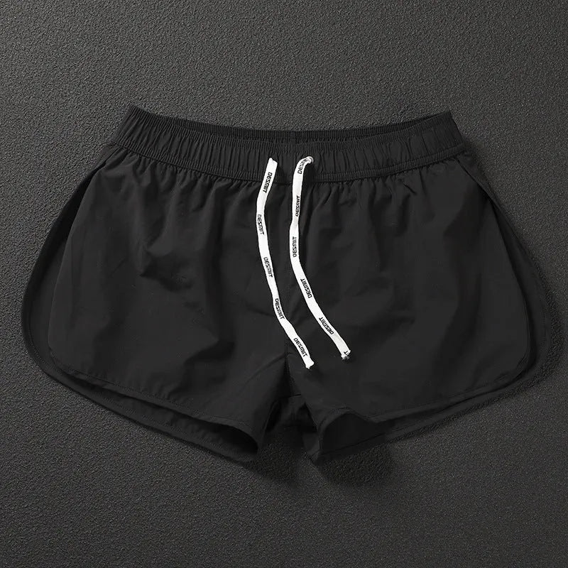 Men's loose fit beach shorts in polyester available in orange red, fluorescent green and black colours