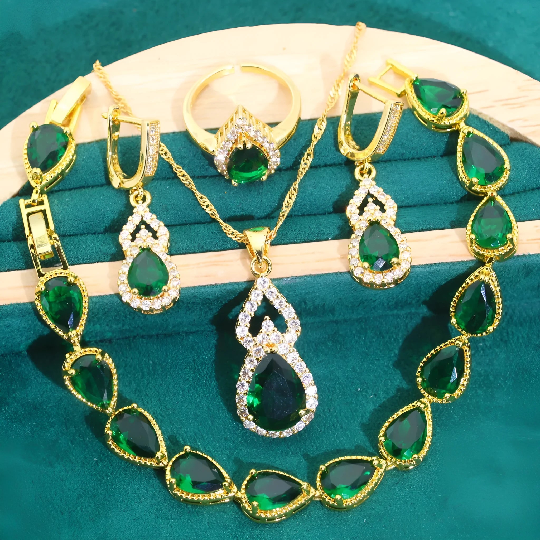 High-end bridal jewelry set with copper inlaid zircon cross and crown pendants in electroplated green and red finish on water wave chain