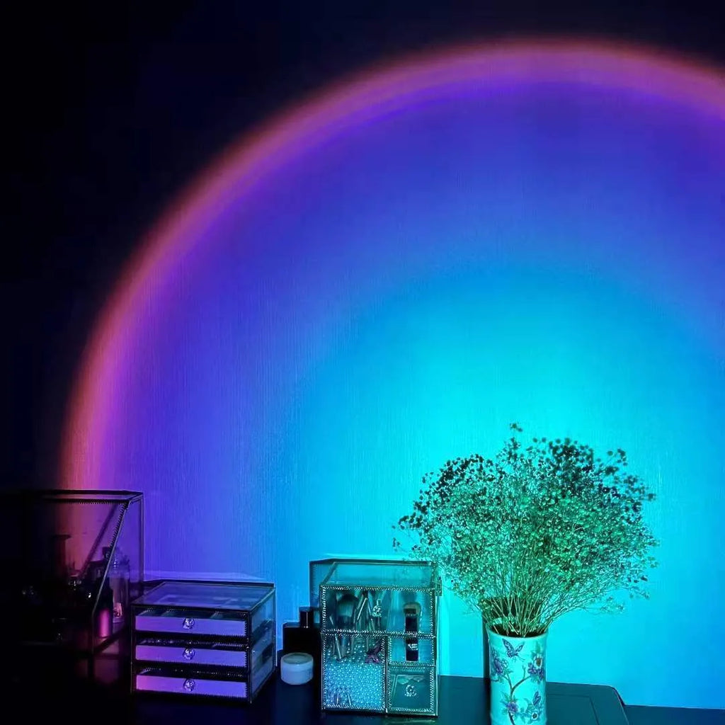 Sunset red coloured USB rechargeable projection lamp showing rainbow light projection