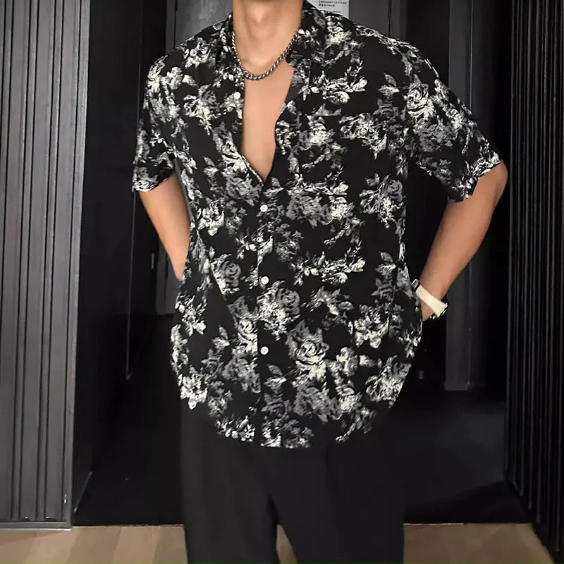 Men's loose black floral print short sleeve casual shirt on a hanger