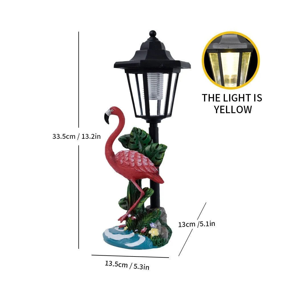 Solar hexagonal garden lamp with decorative resin figurine on plastic base for outdoor pathway lighting