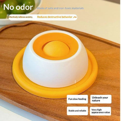 Yellow anti-spill slow feeder cat toy treat dispenser for cats on floor