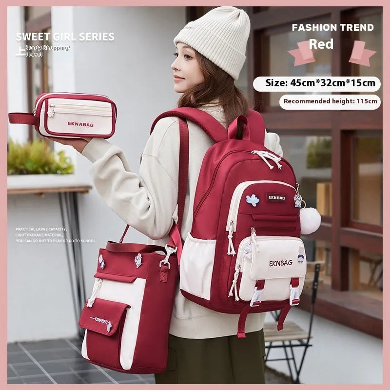 Pink waterproof Oxford cloth school backpack for girls with curved shoulder straps on a white background.