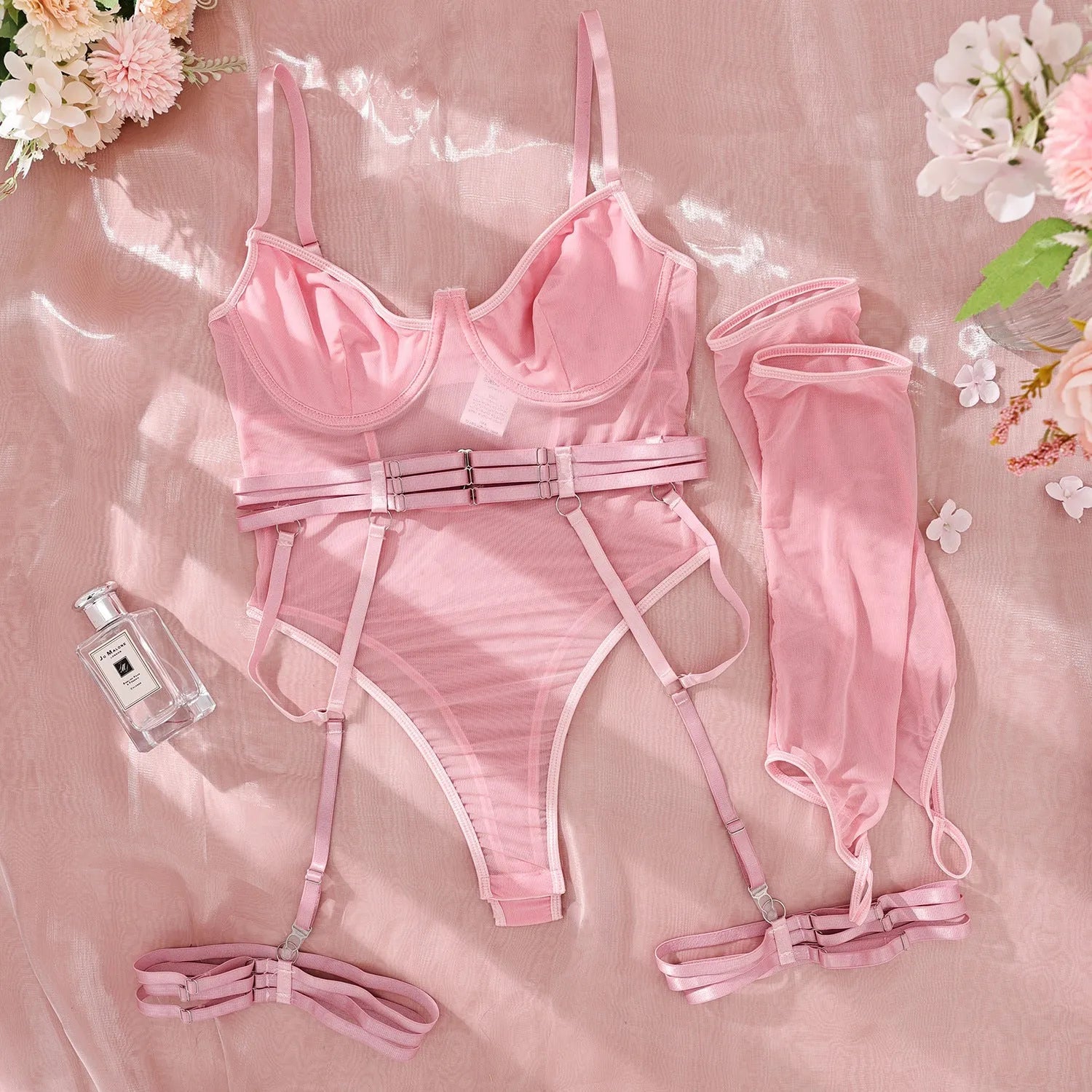 Women's transparent polyester mesh jumpsuit in red colour showing full-body coverage and see-through fabric properties