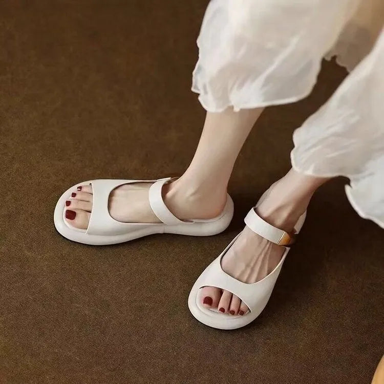 Apricot leather peep toe platform sandals with rubber sole showing open-toe design