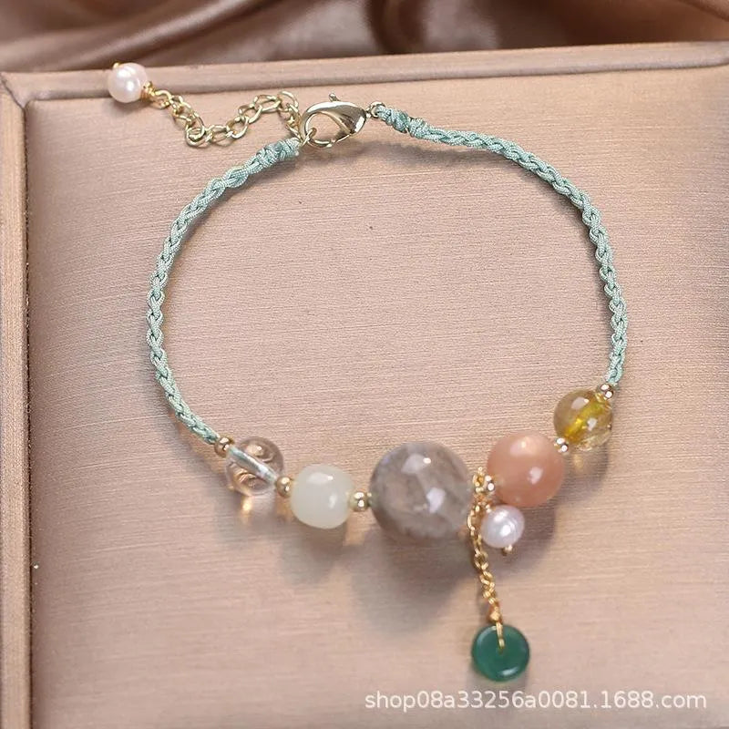 Peace buckle bracelet with crystal sequins on woven wrist string in blue, green, or red