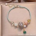 Peace buckle bracelet with crystal sequins on woven wrist string in blue, green, or red