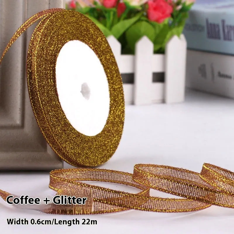Roll of 0.6cm wide polyester gift ribbon in various colours including gold leaf, coffee and sky blue options