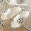 Women's green cat slippers with thick EVA platform sole, shown from above.