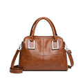 Women's square shoulder bag showing internal phone pocket and document compartment in neutral colour