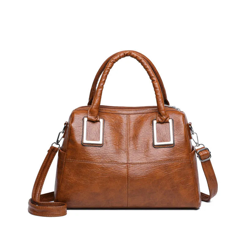Women's square shoulder bag showing internal phone pocket and document compartment in neutral colour