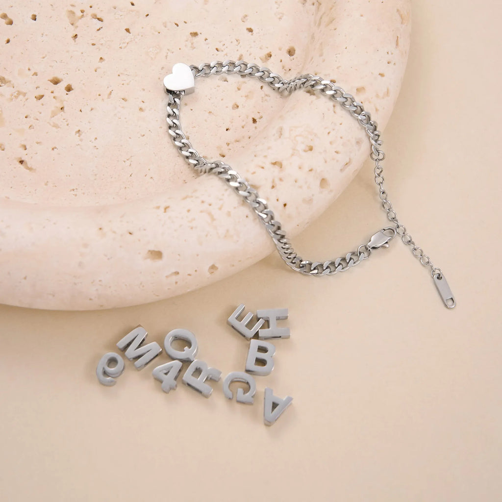Titanium steel personalised necklace showing letter pendant on 40.5cm chain with electroplated gold finish