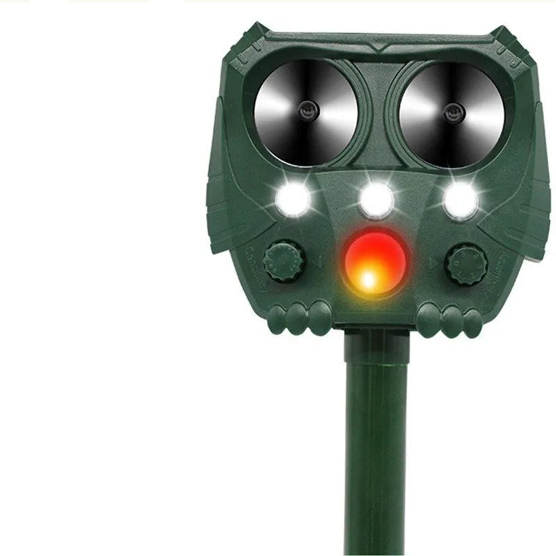 Green solar ultrasonic animal repellent with solar panel showing 12x13x5cm dimensions