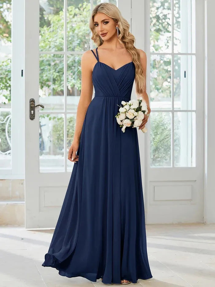 Women's sleeveless pleated A-line dress in light green with sling neckline for banquet occasions
