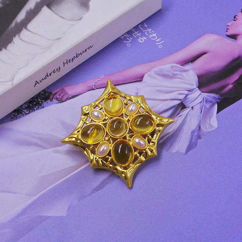 A vintage-style medieval baroque crystal brooch made from zinc alloy, shown in one of eight available colour options.