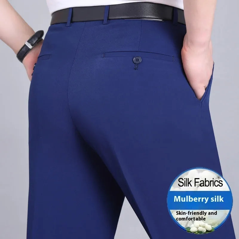 Man wearing dark blue straight-leg suit pants with a high waist, made from a non-ironing mulberry silk blend fabric.