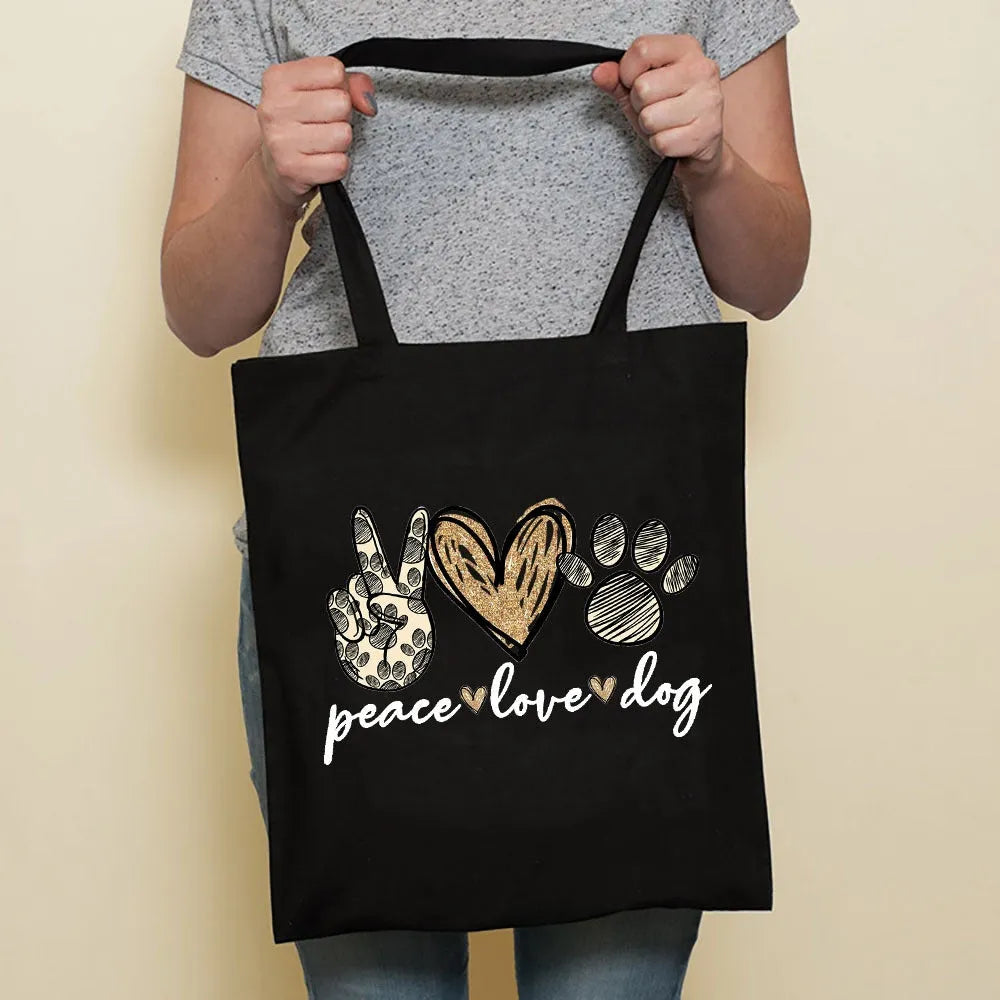 Sausage dog printed canvas bag in black with white dog design on front, sturdy tote for everyday use