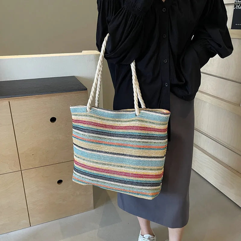 Blue straw woven large capacity single-shoulder bag with nylon construction.