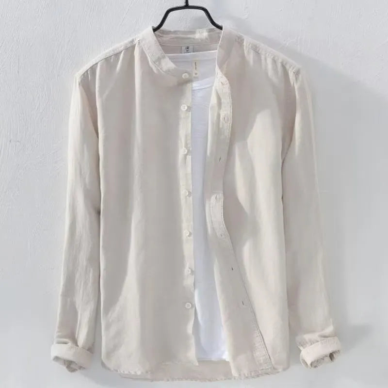 Man wearing a loose-fit light blue long sleeve cotton linen casual shirt.