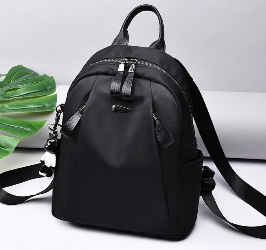 Medium Oxford cloth rucksack with internal phone and ID compartments in wine red colour