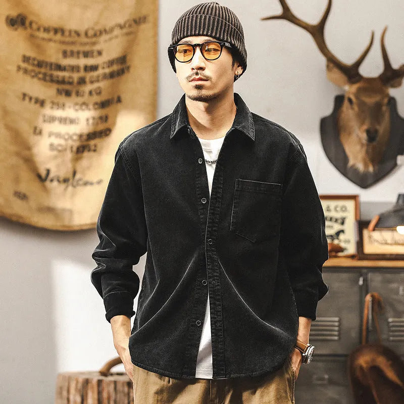 Men's black loose-fit retro corduroy shirt jacket with long sleeves.