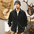 Men's black loose-fit retro corduroy shirt jacket with long sleeves.