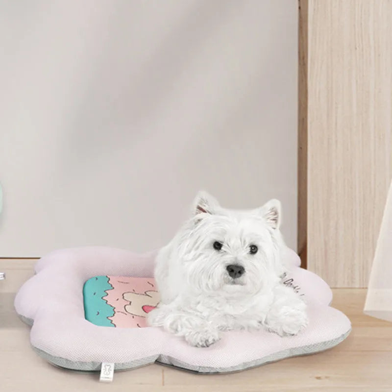 Green pet cooling mat for dogs and cats with fabric cover, shown next to a tape measure indicating its size.
