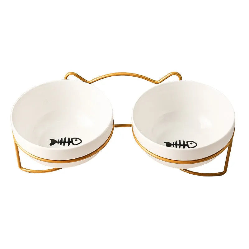 White ceramic cat bowl with decorative patterns on iron frame with cat ear details