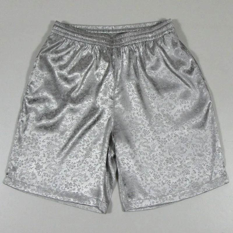 Men's black Tai Chi shorts with an elastic drawstring waistband on a white background.