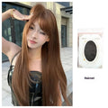 Warm tea chestnut brown long straight synthetic wig with fringe on a model or stand.