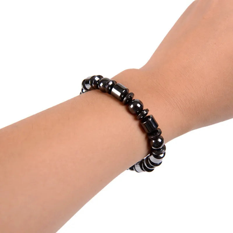 Black pentagram stone magnetic therapy bracelet with magnetite and hematite beads on a stretch band.