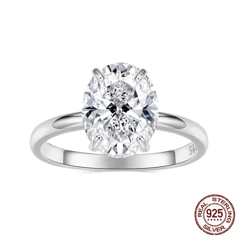 Silver oval cut zircon engagement ring with gold colour electroplating finish on white background