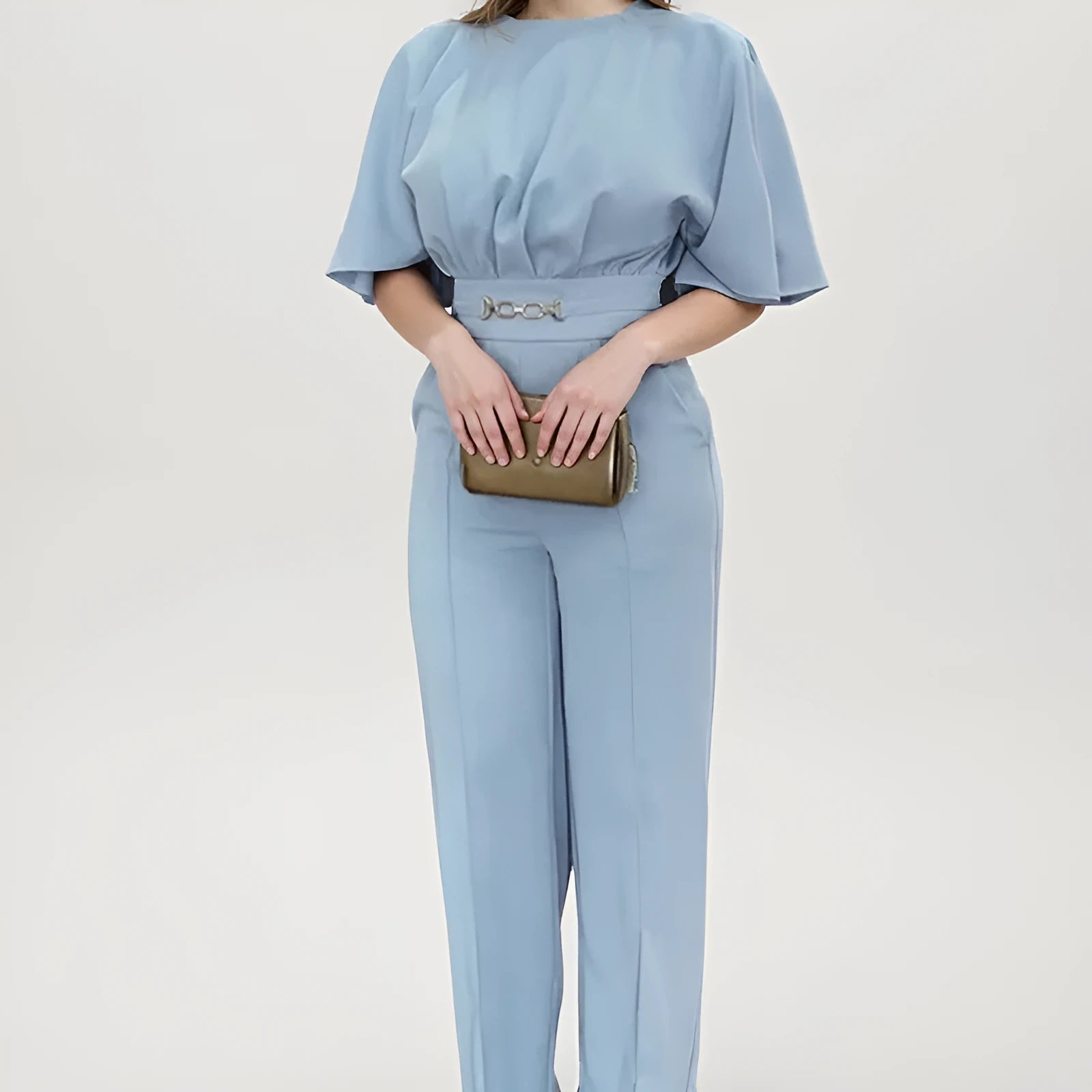 Blue polyester men's two-piece suit with long-sleeved jacket and trousers on hanger