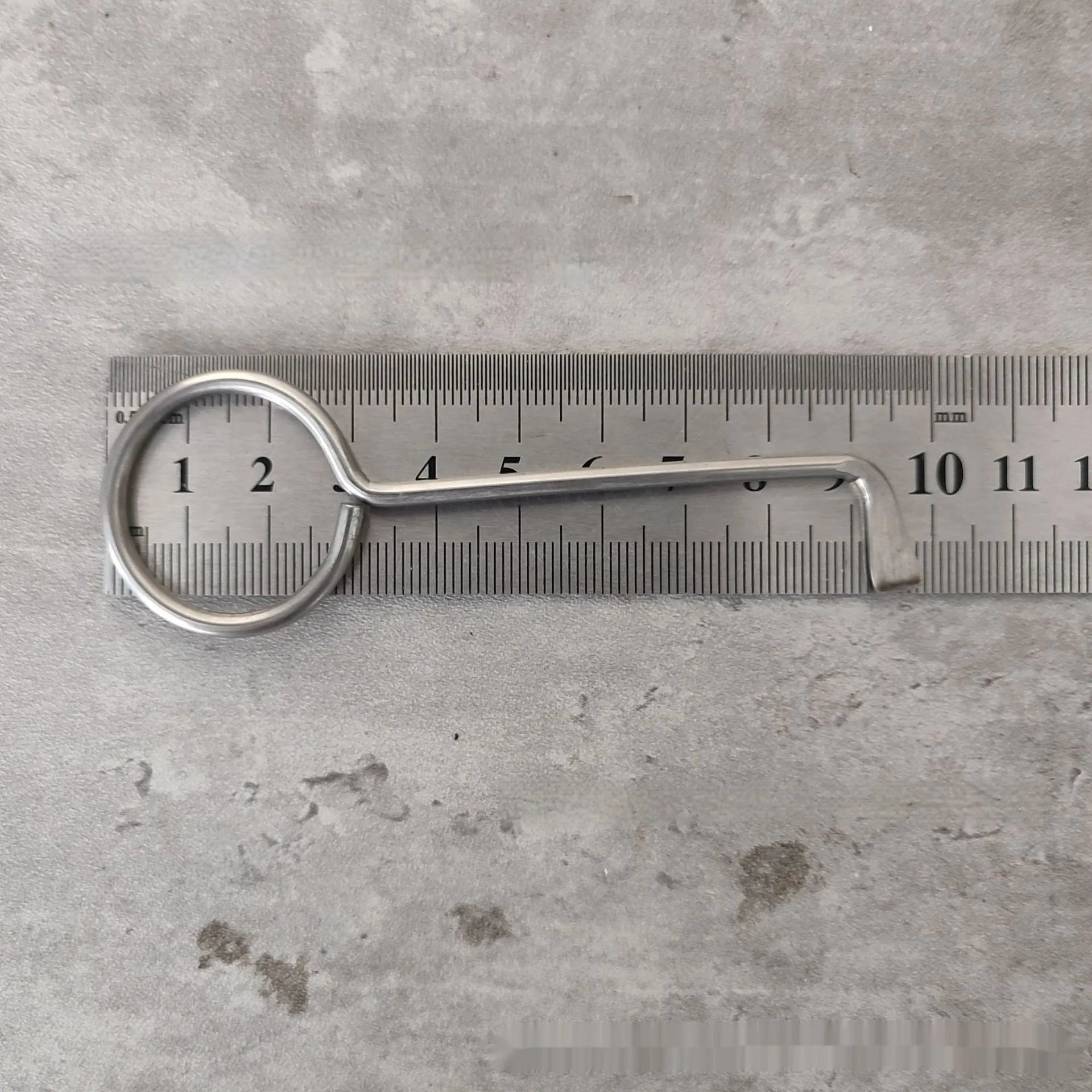 Two identical silver alloy steel wrench tools from a portable household repair set.