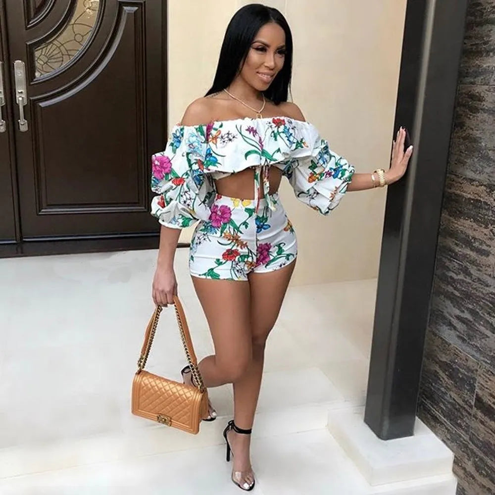 Women's digital print two-piece outfit with pile sleeves on short-sleeve top and matching shorts in multi-colour pattern