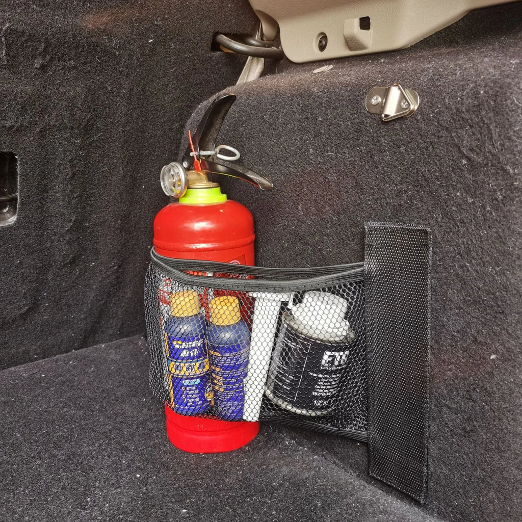 Car trunk elastic storage net organising loose items in vehicle boot