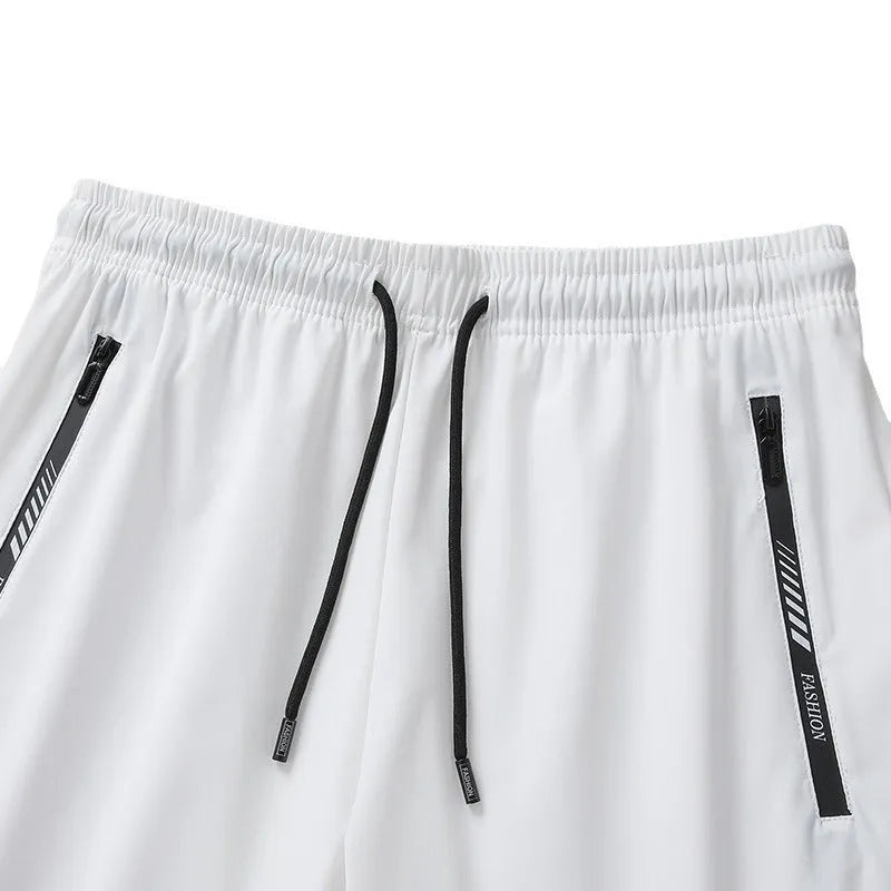 Men's quick-drying nylon sports shorts in black, loose fit with elastic waistband