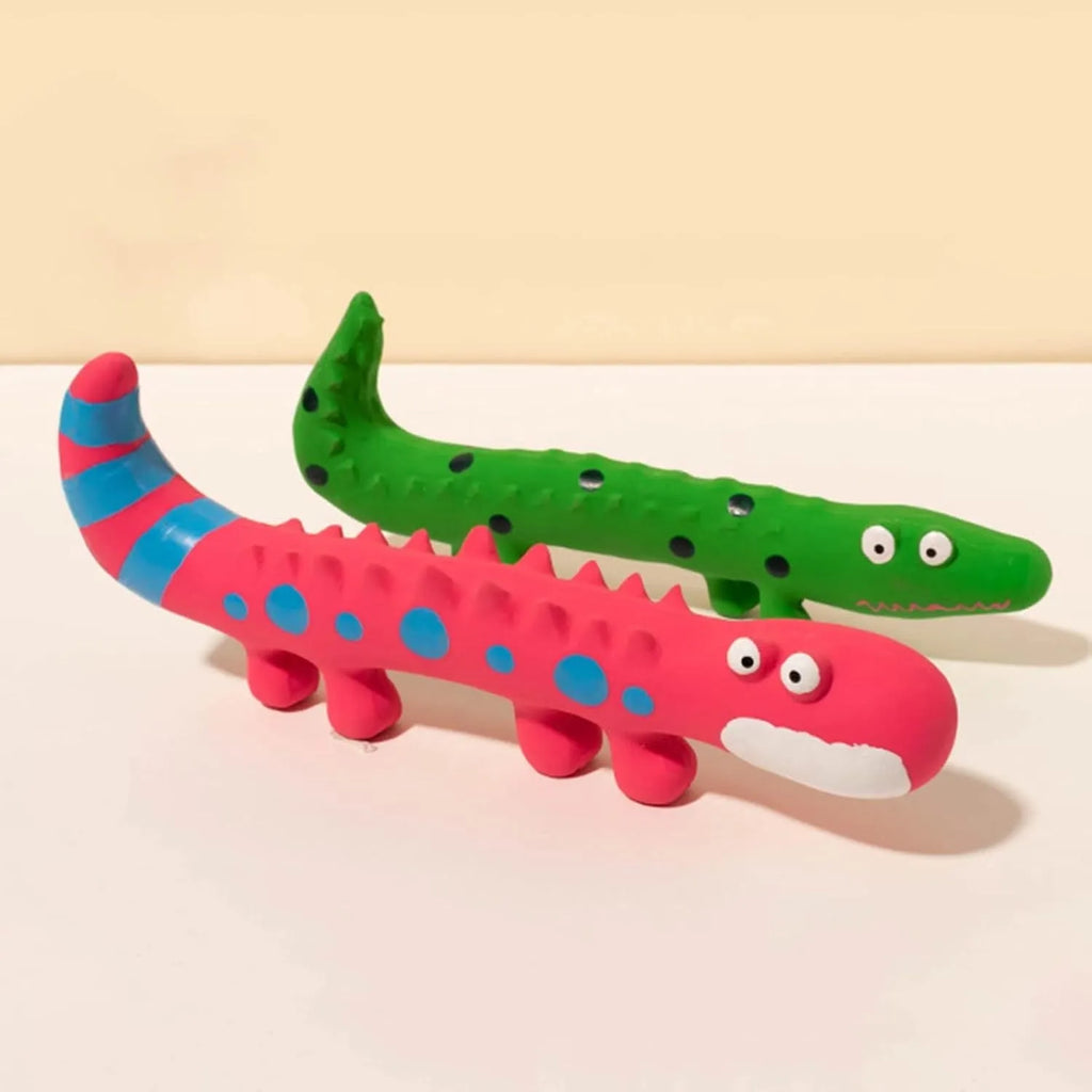 Green cartoon lizard shaped latex dog chew toy with squeaker on a white background