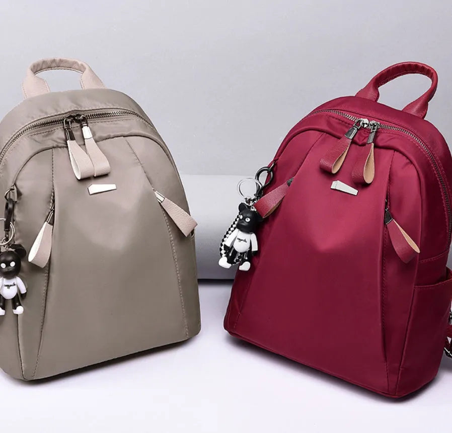 Medium Oxford cloth rucksack with internal phone and ID compartments in wine red colour
