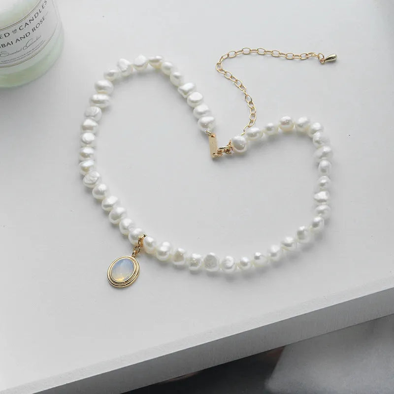 925 silver round medal pearl pendant necklace with irregular pearl geometric design on white background
