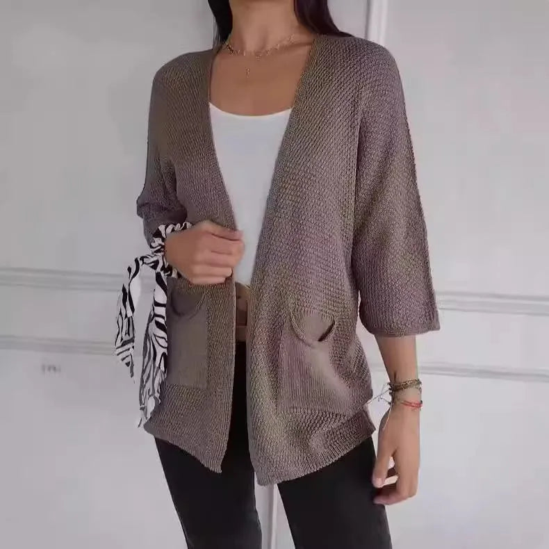 Women's thin waffle knit cardigan coat with nine-quarter sleeves and front pockets in army green.