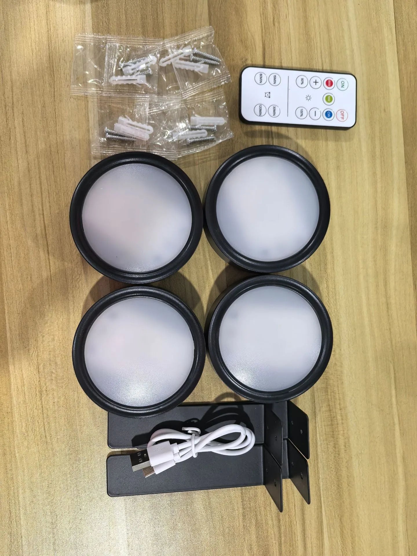 Wireless rechargeable LED painting lamp with magnetic belt attached to a metal frame, remote control nearby.