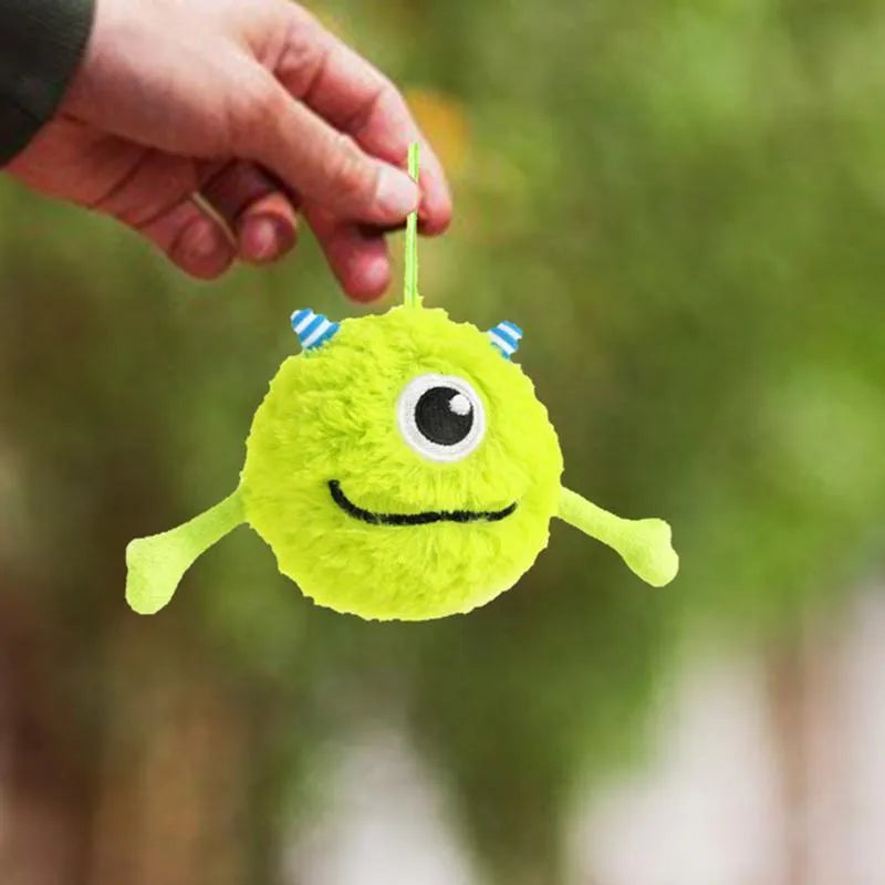 Green plush dog teething toy ball with sound activation feature, 12cm diameter