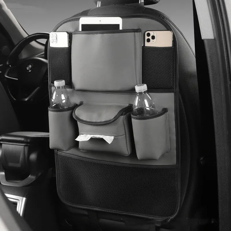 Leather car seat back storage bag in black, brown, green or grey colour hanging behind vehicle seat