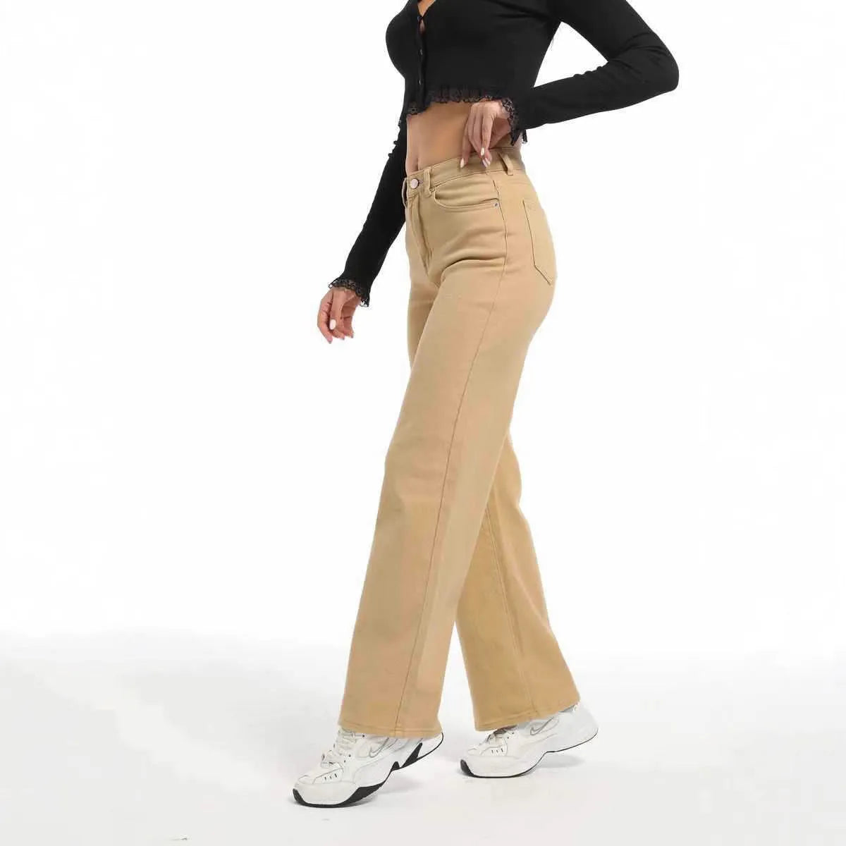 Women's straight leg jeans with wide leg silhouette in apricot colour showing high waist design