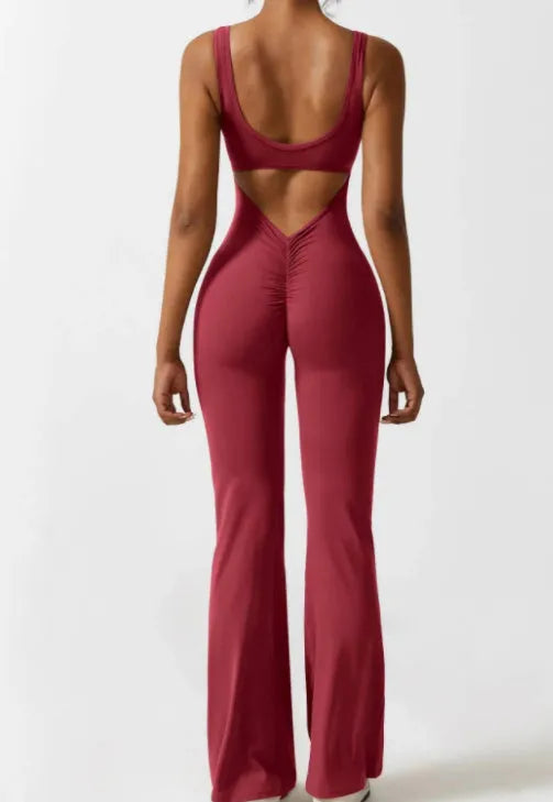 Women's black milk silk yoga bodysuit with hollow back and seamless construction on a mannequin.