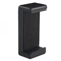 Black plastic phone holder with rotating clamp on a desk