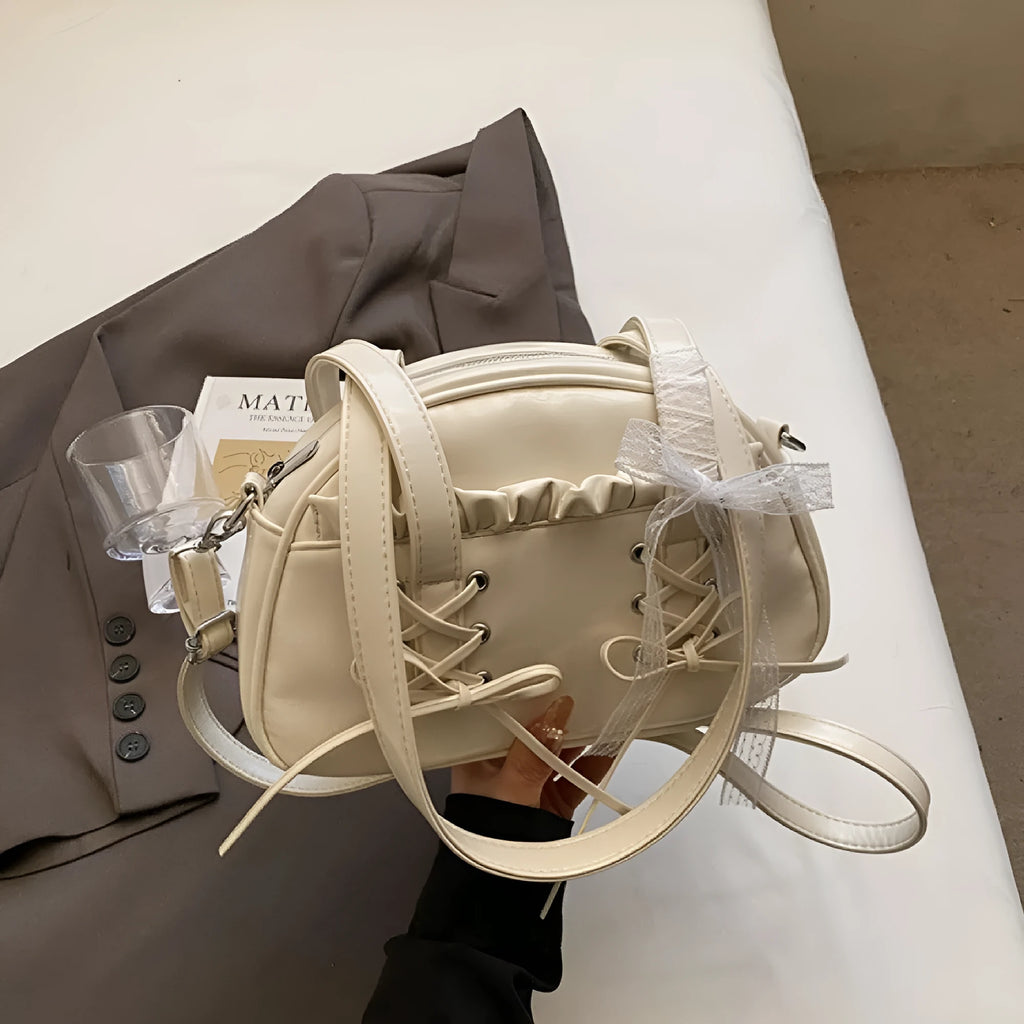 Women's casual bandage bow handbag in PU with shoulder strap and sewing thread detailing.